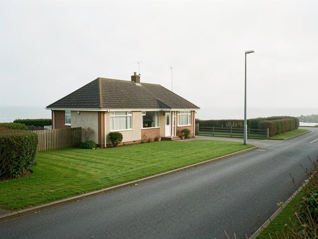 A detached bungalow with a neat lawn near the sea in Lowestoft